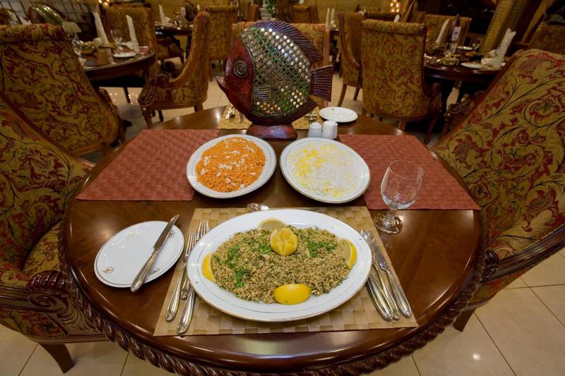 United Arab Emirates - Abu Dhabi - Nov 14 - 2009 : The traditional Emirati fish dish called Jasheed , served with Muhammen rice (left) and Safaran rice, at Al Areesh restaurant. ( Jaime Puebla / The National) OASIS *** Local Caption ***  JP Jasheed 14.jpg