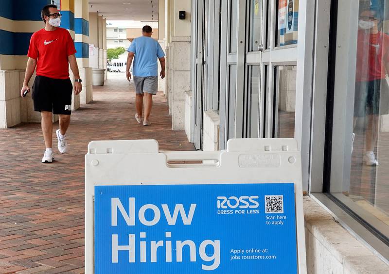 A Now Hiring sign near the entrance to a Ross department store in Hallandale, Florida. Unemployment in the US fell to 5.2% in August. Getty Images