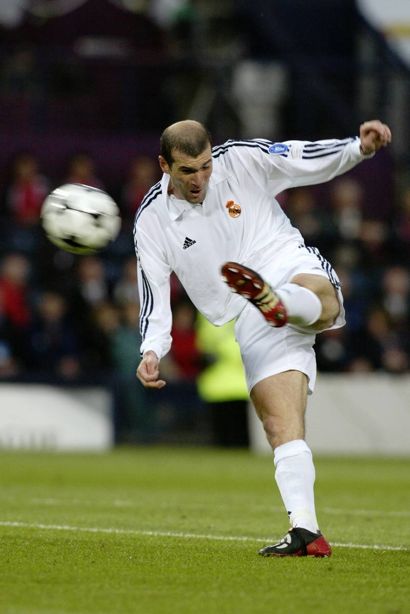 GLASGOW - May 15:  Zinedine Zidane of Real Madrid scores a wonderful goal during the UEFA Champions League Final between Real Madrid and Bayer Leverkusen played at Hampden Park, in Glasgow, Scotland on May 15, 2002. Real Madrid won the match and cup 2-1. DIGITAL IMAGE. (Photo by Phil Cole/Getty Images)