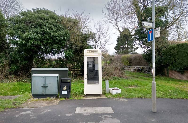 A cream coloured K8 phone kiosk on Main Road, Wawne, near Hull, East Yorkshire. Photo: Historic England