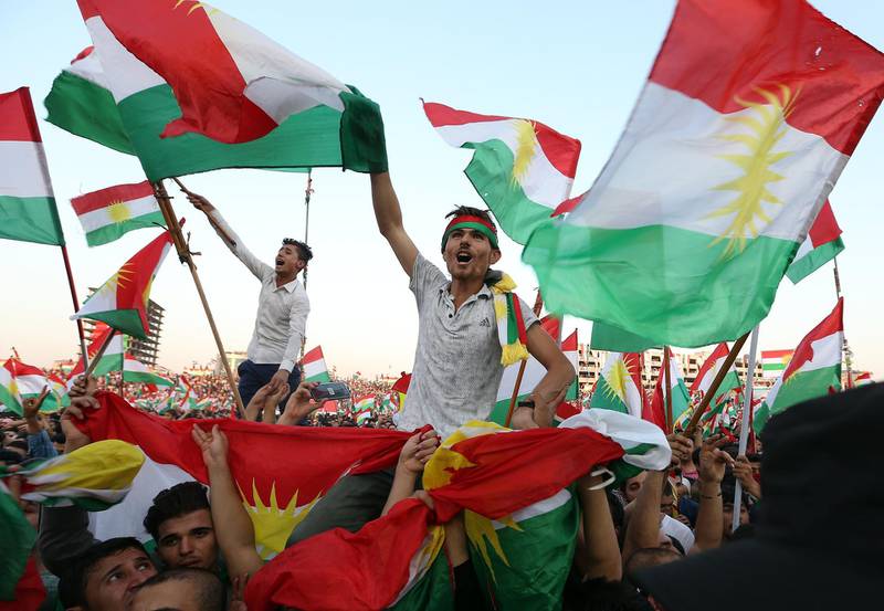 epa06220217 Kurds hold Kurdish flags as they take part in a rally for the Kurdistan independence referendum campaign at the Franso Hariri stadium in Erbil, Iraq, 22 September 2017. The Kurdistan region is an autonomous region in northern Iraq since 1991, with an estimated population of 5.3 million people. The region share borders with Turkey, Iran, and Syria, all of which have large Kurdish minorities. On 25 September the Kurdistan region holds a referendum for independence and the creation of the state of Kurdistan amidst divided international support.  EPA/MOHAMED MESSARA