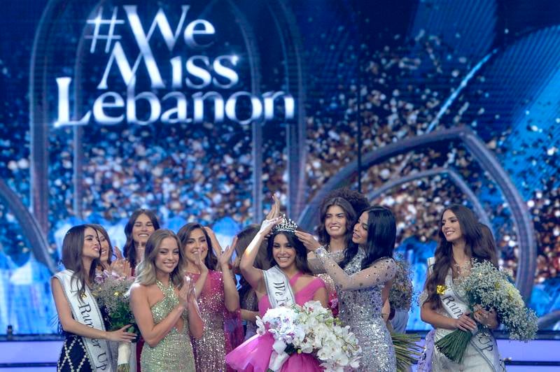 Zaytoun, centre, is crowned Miss Lebanon 2022, meaning she represents her nation at Miss Universe and Miss World. EPA