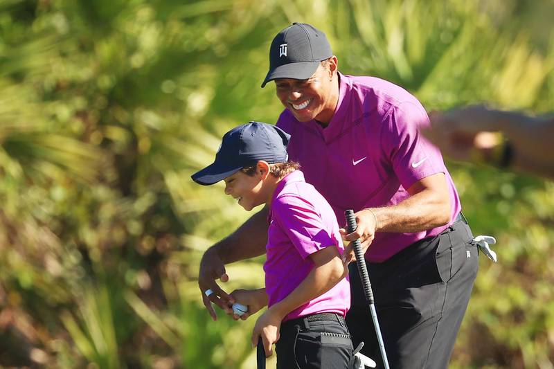 Tiger Woods and his son Charlie on the third green during the first round of the PNC Championship in Orlando, Florida. AFP