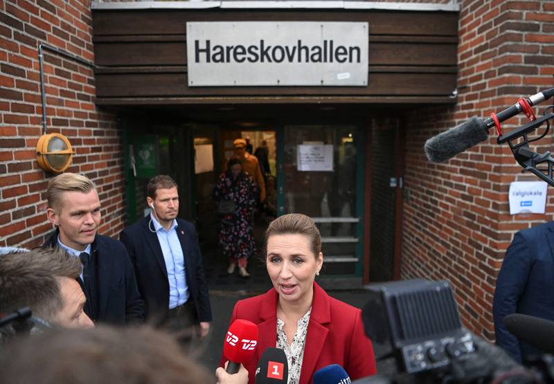 Mette Frederiksen, Prime Minister of Denmark and leader of the Social Democrats, addresses the media after casting her vote in Hareskovhallen. AFP
