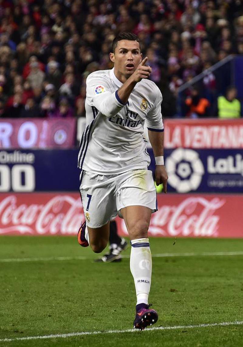 Cristiano Ronaldo celebrates a goal against Atletico Madrid at the Vicente Calderon stadium in Madrid on November 19, 2016. Gerarde Julien / AFP