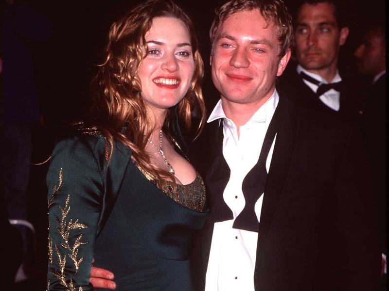 Kate Winslet, in a green Renaissance-inspired dress, and Jim Threapleton attend a 'Vanity Fair' party in Beverly Hills, California, on March 23, 1998. Getty Images