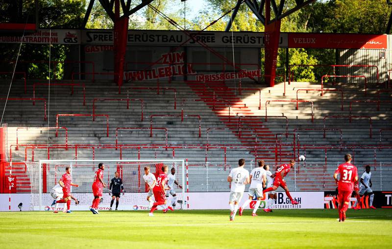 Union Berlian and Bayern Munich players in action in front of empty stands. AFP