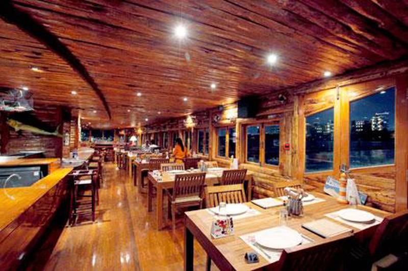 Aprons & Hammers is located in a cosy converted dhow, with wood panelling and fishing nets.