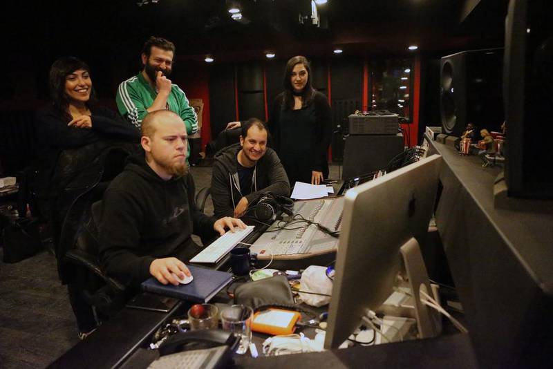 The team working with producer Chris Mullender in the studio where they record their Arabic songs for Adam Wa Mishmimish. Salah Malkawi for The National