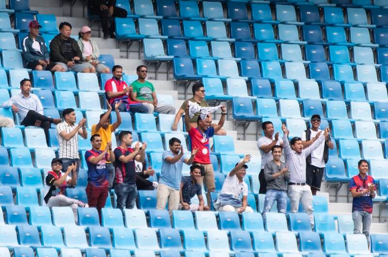 Nepal fans watch the game at Dubai International Stadium.  