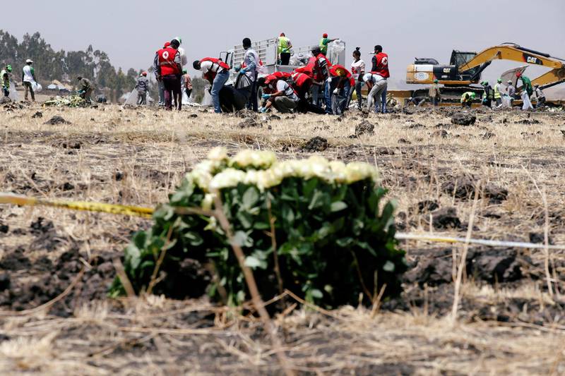 Members of the Ethiopian red cross search for remains at the Ethiopian Airlines Flight ET 302 plane crash before a commemoration ceremony at the scene of the crash, near the town of Bishoftu, southeast of Addis Ababa, Ethiopia. Reuters