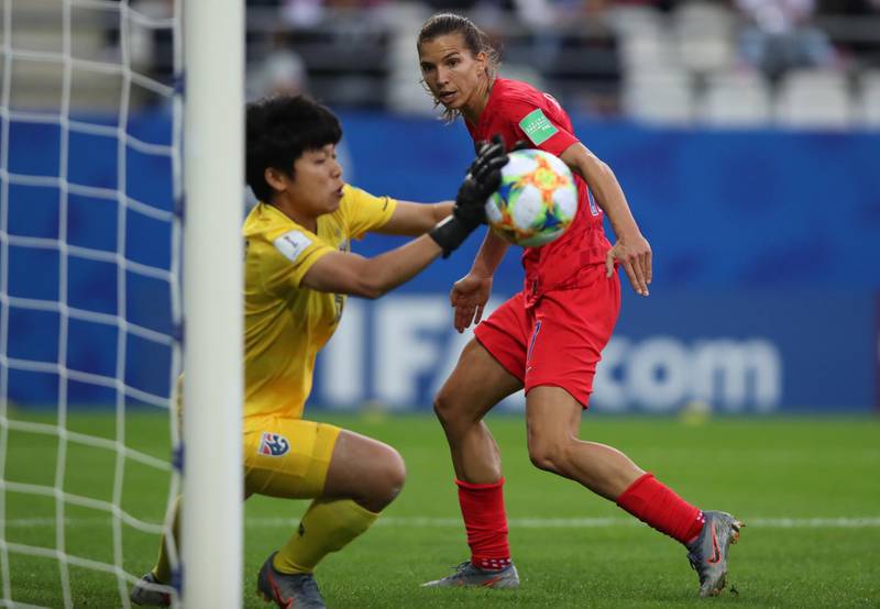 Alex Morgan, right, of USA in action against goalkeeper Sukanya Chor Charoenying of Thailand. EPA