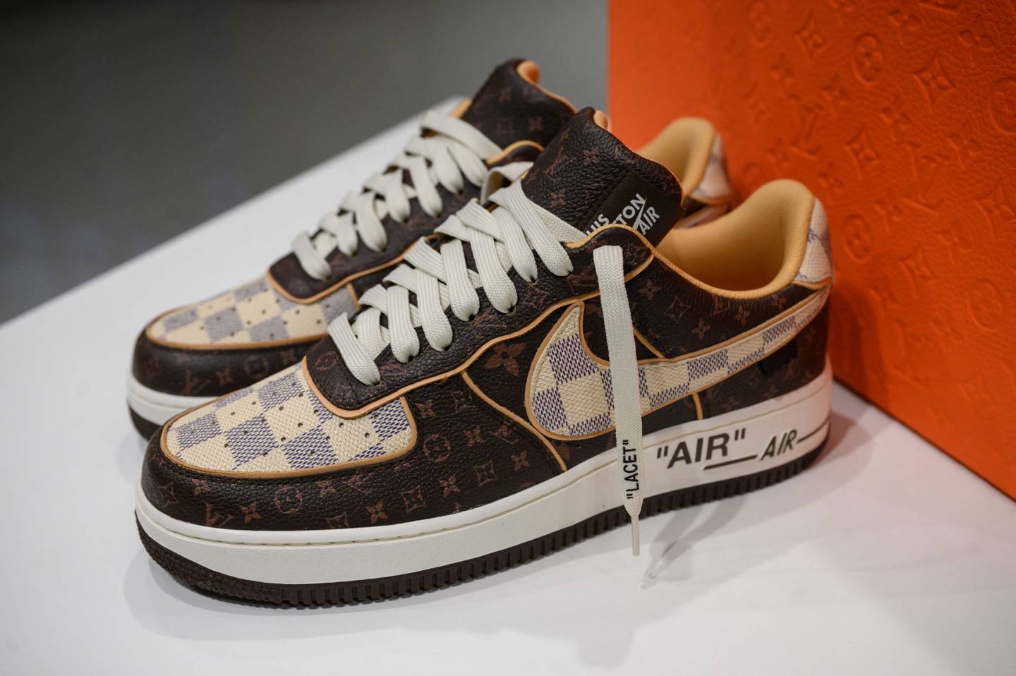 A pair of Louis Vuitton Nike Air Force 1 trainers displayed at Sotheby's in New York. AFP