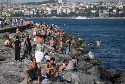 People spend time near the Bosphorus on a sunny day in Istanbul, Turkey. Turkish authorities have now allowed the reopening of restaurants, cafes, parks and beaches, besides lifting the ban on inter-city travel. EPA