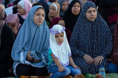 Muslims women wait to perform the Eid Al Adha morning prayer, in Amman, Jordan.  EPA
