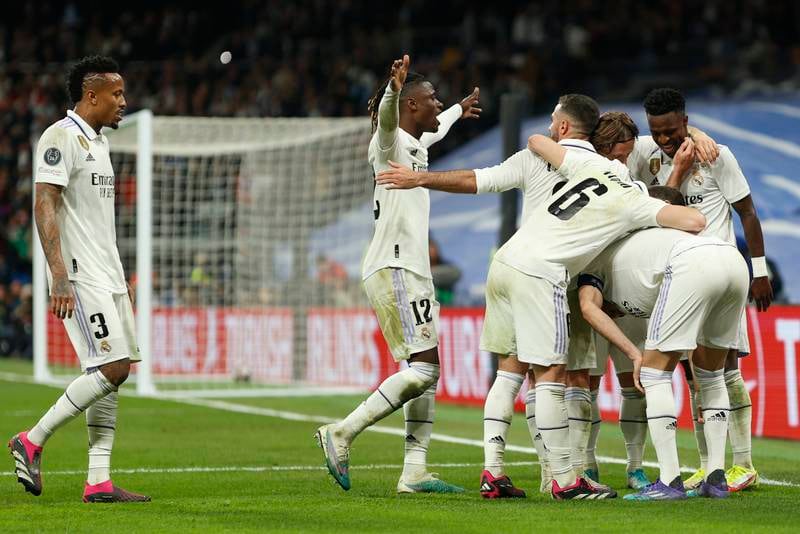 Real Madrid players celebrate after taking the lead in the 1-0 Champions League round of 16 win against Liverpool on March 15, 2023. EPA