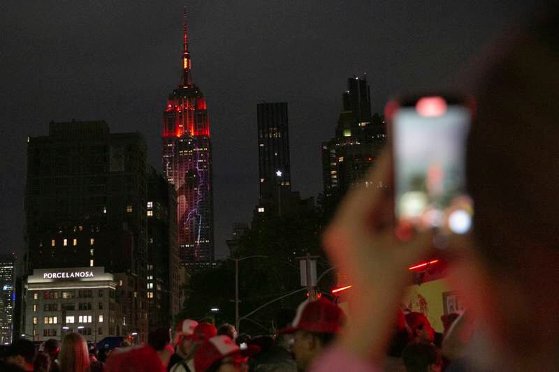 Fans at the unveiling of the projection on the Empire State Building. EPA