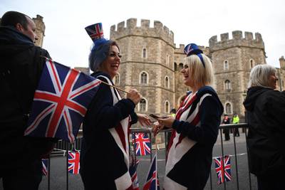Royal supporters get into position outside of Windsor Castle ahead of the Royal wedding of Princess Eugenie of York and Mr Jack Brooksbank at St. George's Chapel  in Windsor, England.  Getty Images