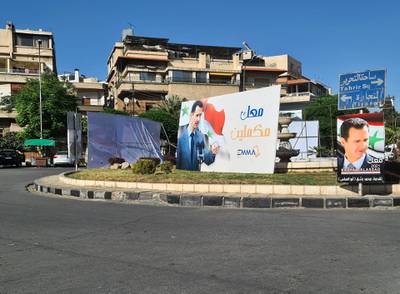 Damascus, Al-Qusour roundabout telecommunications provider Emmatel post fealty message to Assad