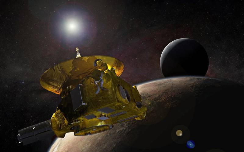 epa07251922 A handout photo made available by NASA shows an artist’s concept of the New Horizons spacecraft as it approaches Pluto and its largest moon, Charon, in July 2015  (issued 28 December 2018). NASA's New Horizons spacecraft will pass the Solar System's most distant space rock 2014 MU69, nicknamed Ultima Thule, a Kuiper Belt object that orbits the Sun 1 billion miles (1.6 billion kilometers) beyond Pluto in a flyby on New Year 01 January 2019.  EPA/NASA/JHUAPL/SwRI / HANDOUT  HANDOUT EDITORIAL USE ONLY/NO SALES HANDOUT EDITORIAL USE ONLY/NO SALES
