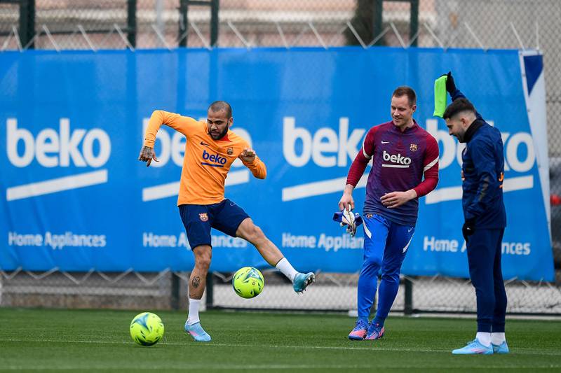 Barcelona defender Dani Alves and goalkeeper Marc-Andre ter Stegen take part in a training session. AFP