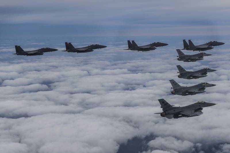 A South Korea Defence Ministry photo of F15K fighter jets and US Air Force F-16s flying in formation during a joint drill. AP