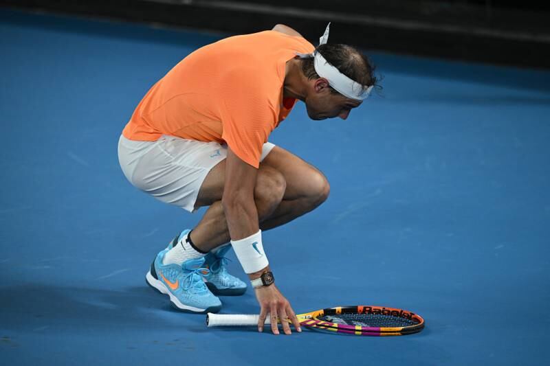 Rafael Nadal bends over injured during his match against Mackenzie McDonald at the Australian Open. EPA
