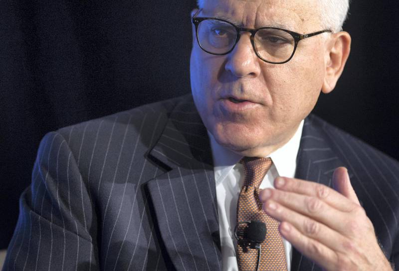 David Rubenstein, CEO of the Carlyle Group and President of the Economic Club of Washington, speaks during an Economic Club of Washington event in Washington, DC, October 19, 2017. / AFP PHOTO / SAUL LOEB