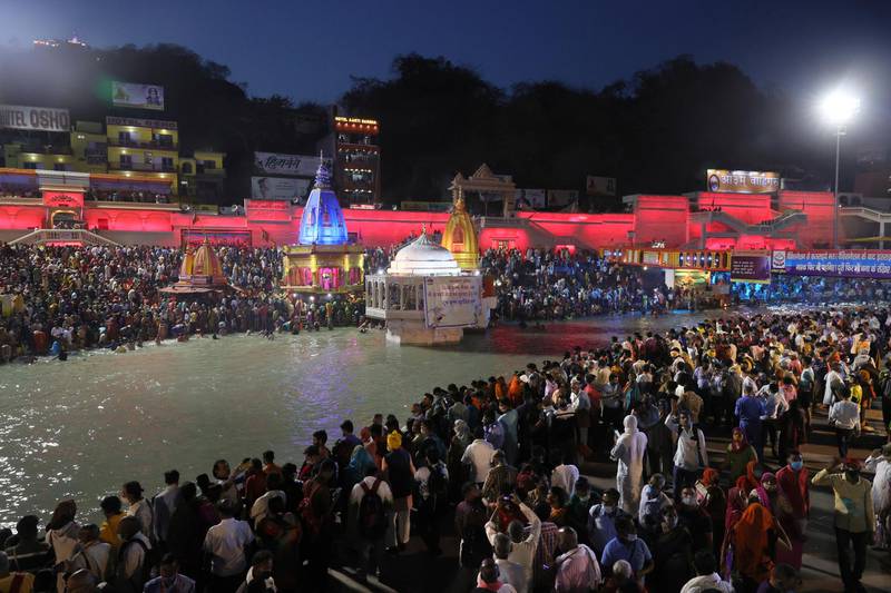 Tens of thousands of Hindu devotees gathered by the Ganges River for special prayers on Monday, many of them flouting social distancing practices as the coronavirus spreads in India with record speed. AP