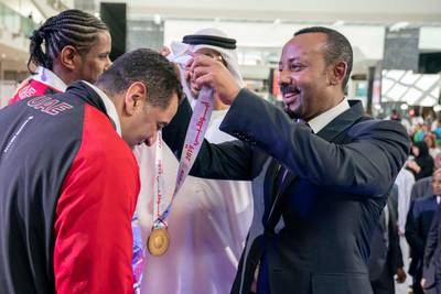 ABU DHABI, UNITED ARAB EMIRATES - March 18, 2019: HE Abiy Ahmed, Prime Minister of Ethiopia (R) presents a medal to an athlete during the Special Olympics World Games Abu Dhabi 2019, at Abu Dhabi National Exhibition Centre (ADNEC).

( Ryan Carter / Ministry of Presidential Affairs )?
---