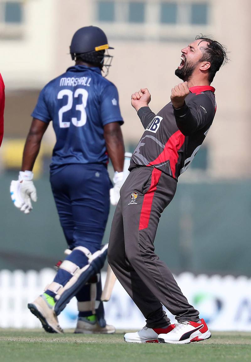 DUBAI, UNITED ARAB EMIRATES , Dec 12– 2019 :- Rohan Mustafa of UAE (right) celebrating after taking the wicket of Steven Taylor during the World Cup League 2 cricket match between UAE vs USA held at ICC academy in Dubai. ( Pawan Singh / The National )  For Sports. Story by Paul