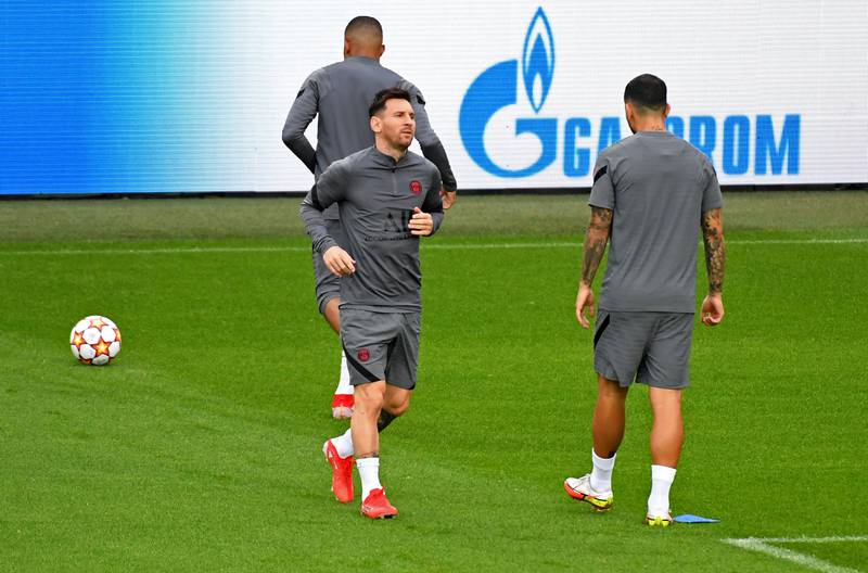 Lionel Messi with teammates during training. Reuters