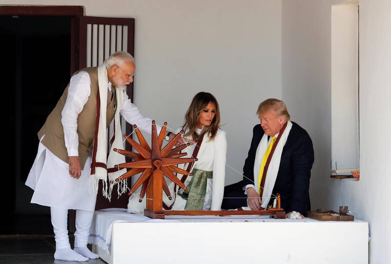 US President Donald Trump and first lady Melania Trump look at Charkha, a type of Indian spinning wheel, next to Indian Prime Minister Narendra Modi, as they visit the Gandhi Ashram in Ahmedabad, India. Reuters