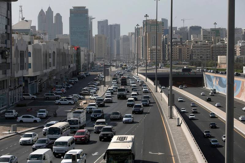 ABU DHABI, UNITED ARAB EMIRATES, May 13, 2015:  
Cars line up in thickening traffic during the beginning of rush hour on Wednesday, May 13, 2015, at an exit near the Sheikh Zayed road and the Sheikh Zayed tunnel in Abu Dhabi. A recent yougov survey-it says commute times in Abu Dhabi are down, and drivers are happier, but the roads still have a lot of inattentive drivers. (Silvia Razgova / The National)  (Usage: May 13, 2015, Section: NA, Reporter: ) *** Local Caption ***  SR-150513-traffic06.jpg