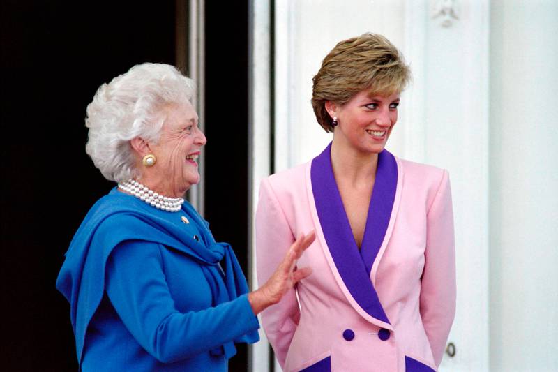 (FILES) This file photo taken on October 5, 1990 shows, US First Lady Barbara Bush (L) and Britain's Diana, Princess of Wales, posing for photographers after the Princess arrived at the White House in Washington.
Princess Diana revolutionised the royal dress code with the help of some of the world's greatest designers during a glamorous life that came to a tragic end on August 31, 1997, 20 years ago this month. / AFP PHOTO / Pamela PRICE