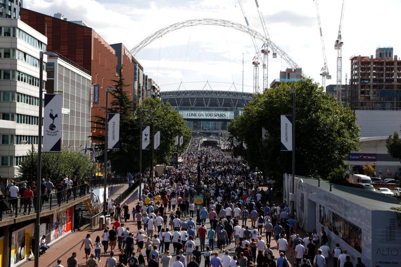 Football Soccer - Premier League - Tottenham Hotspur vs Burnley - London, Britain - August 27, 2017   General view of fans walking towards Wembley stadium before the match   Action Images via Reuters/Matthew Childs    EDITORIAL USE ONLY. No use with unauthorized audio, video, data, fixture lists, club/league logos or "live" services. Online in-match use limited to 45 images, no video emulation. No use in betting, games or single club/league/player publications. Please contact your account representative for further details.
