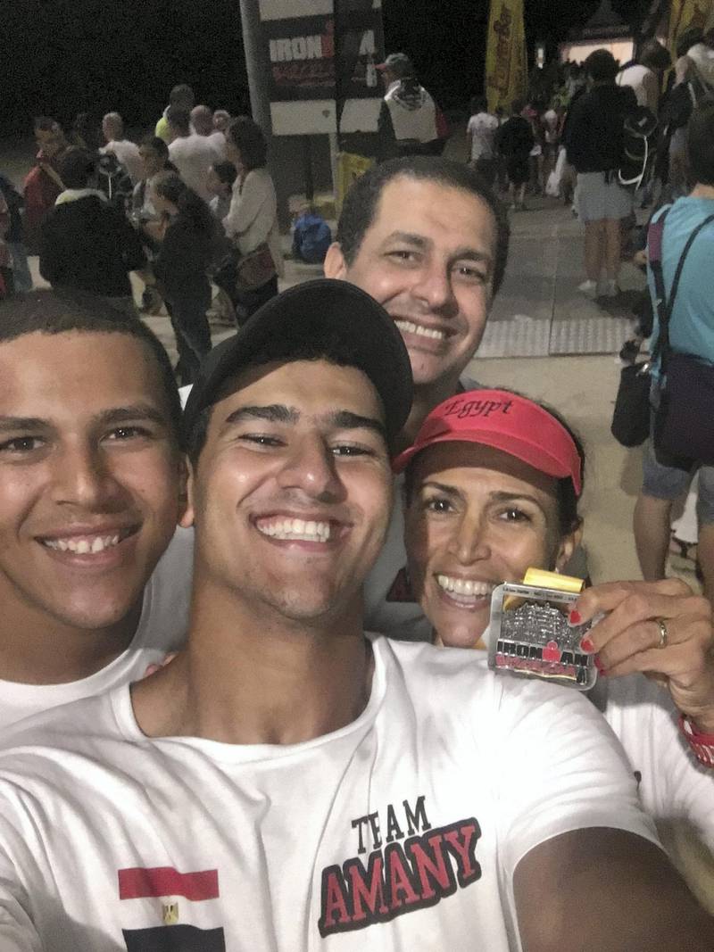 Amany Khalil with her husband and two sons after completing the Ironman in Barcelona.