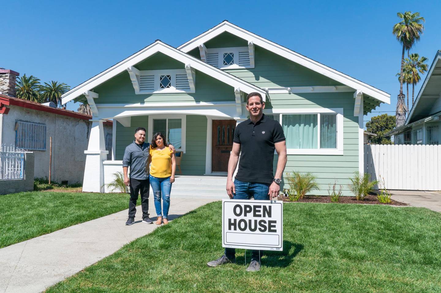 As seen on Flipping 101, house flipping guru, Tarek El Moussa (R) mentors first time home flippers Victor Quinones (L) and Deanna Esqueda (C) as they prepare for the Open House of their first home flip.