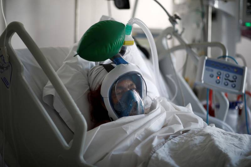 A patient suffering from coronavirus disease (COVID-19) wears a full-face Easybreath snorkelling mask given by sport chain Decathlon and turned into a ventilator for coronavirus treatment at the intensive care unit at Ambroise Pare clinic in Neuilly-sur-Seine near Paris. REUTERS