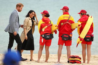 MELBOURNE, AUSTRALIA - OCTOBER 18:  Prince Harry, Duke of Sussex and Meghan, Duchess of Sussex meet with lifeguards at South Melbourne Beach on October 18, 2018 in Melbourne, Australia. BeachPatrol is a network of volunteers who are passionate about keeping Melbourne's beaches and foreshores clear of litter to reduce the negative impact of litter on the marine environment and food chain, and provide a safe environment for the public to enjoy their local beach.The Duke and Duchess of Sussex are on their official 16-day Autumn tour visiting cities in Australia, Fiji, Tonga and New Zealand.  (Photo by Scott Barbour/Getty Images)