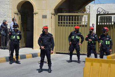 Security members stand guard outside a military court where the trial of former royal court chief Bassem Awadallah is set to take place. Reuters