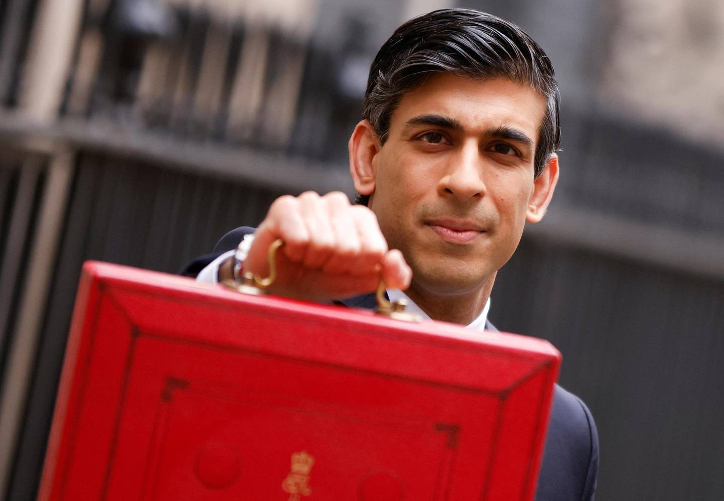 Britain's Chancellor of the Exchequer Rishi Sunak holds the budget box outside Downing Street in London, Britain, March 3, 2021. REUTERS/John Sibley     TPX IMAGES OF THE DAY