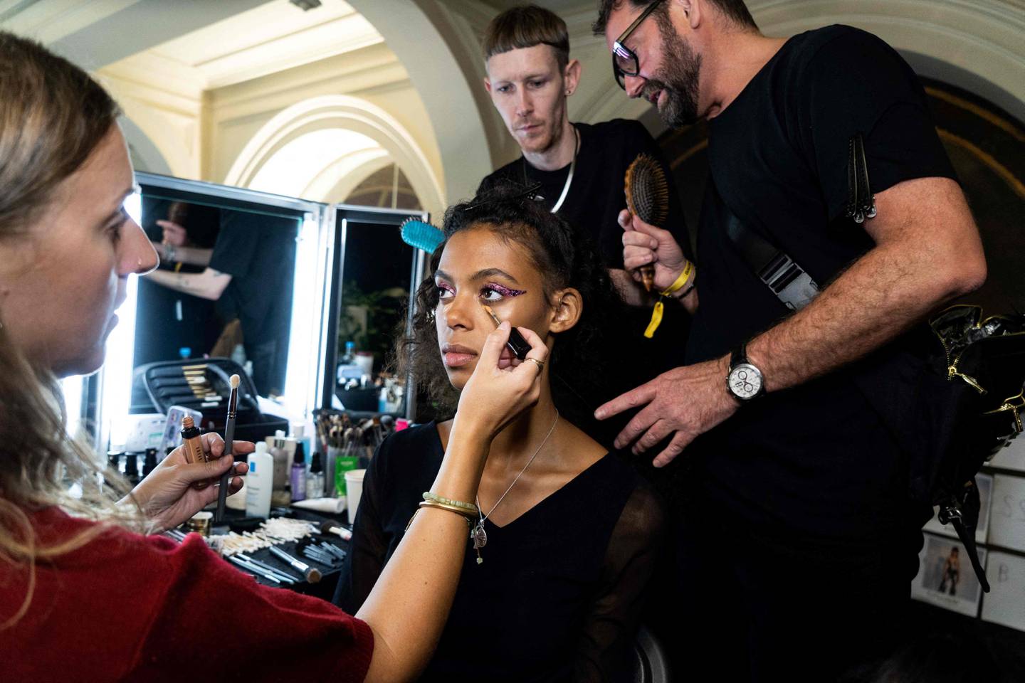 A model gets ready backstage prior to the Halpern spring/summer 2023 show on Sunday, the fourth day of London Fashion Week. All shows and events for Monday have been cancelled as a mark of respect to Queen Elizabeth II. AFP