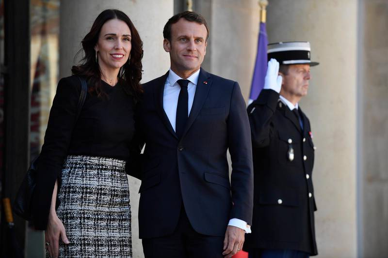 epaselect epa07572572 French President Emmanuel Macron (C) greets New Zealand's Prime Minister Jacinda Ardern (L) upon her arrival for the 'Christchurch Call Meeting' in Paris, France, 15 May 2019. The high level summit held in Paris aims at ways to tackle and eliminate terrorism and violent extremist content online.  EPA/JULIEN DE ROSA