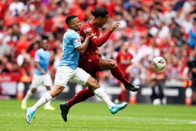 Virgil van Dijk (r) in action against Manchester City's Gabriel Jesus.  EPA