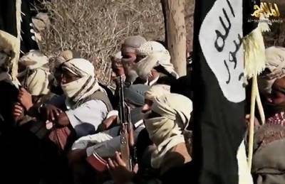 An image grab taken on April 16, 2014 from a video released on March 29, 2014 by Al-Malahem Media, the media arm of Al-Qaeda in the Arabian Peninsula (AQAP), allegedly shows AQAP jihadists listening to their chief Nasser al-Wuhayshi at an undisclosed location in Yemen. Wuhayshi has pledged in a rare video appearance to pursue the war against the Western "crusaders" everywhere possible. AFP PHOTO/HO/AL-MALAHEM MEDIA
=== RESTRICTED TO EDITORIAL USE - MANDATORY CREDIT "AFP PHOTO/HO/AL-MALAHEM MEDIA" - NO MARKETING NO ADVERTISING CAMPAIGNS - DISTRIBUTED AS A SERVICE TO CLIENTS === (Photo by - / AL-MALAHEM MEDIA / AFP)