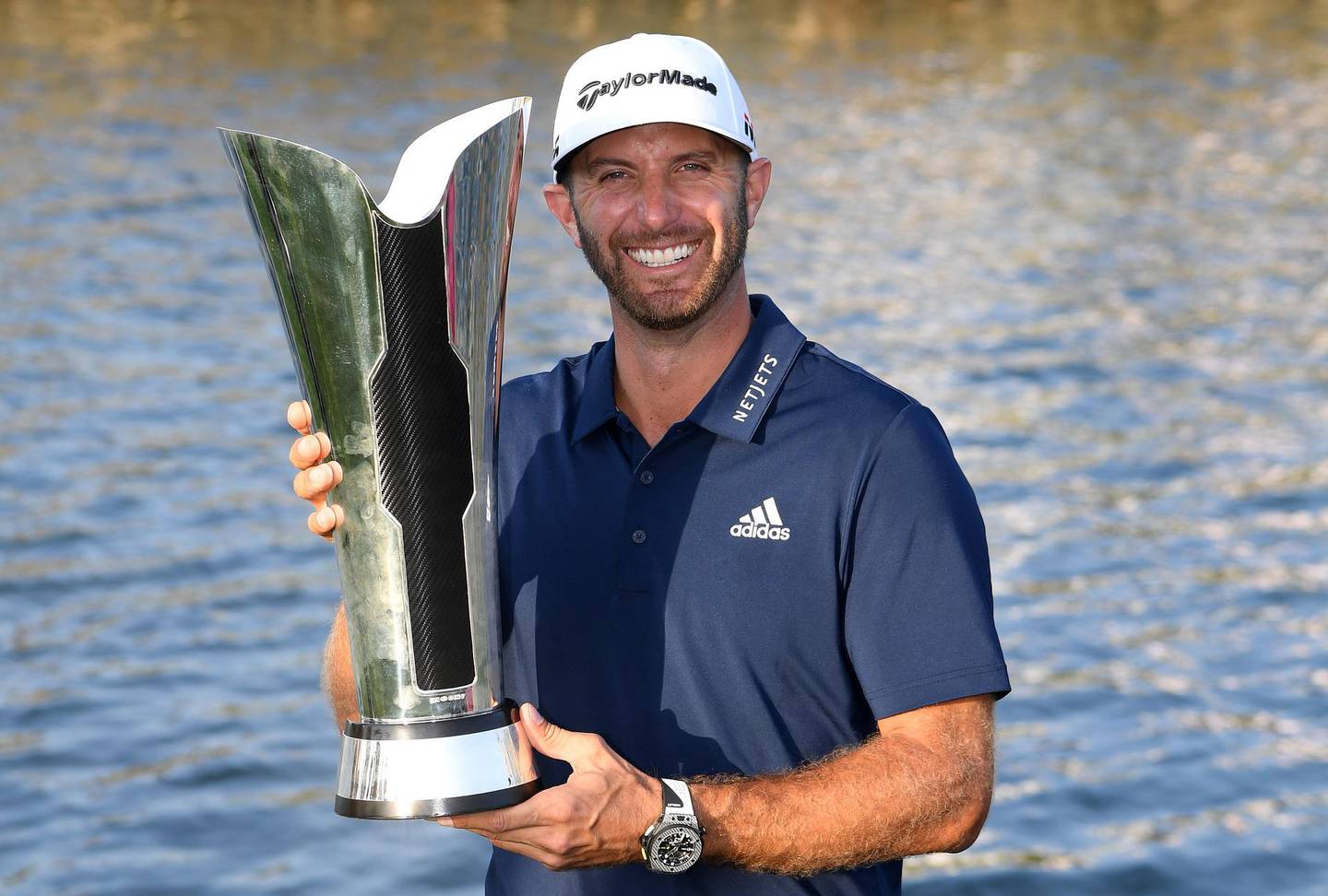 KING ABDULLAH ECONOMIC CITY, SAUDI ARABIA - FEBRUARY 03: Dustin Johnson of The United States celebrates with the trophy after the final round of the Saudi International at the Royal Greens Golf & Country Club on February 03, 2019 in King Abdullah Economic City, Saudi Arabia.  (Photo by Ross Kinnaird/Getty Images)