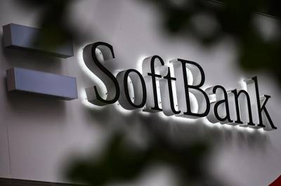 The SoftBank logo is seen at the entrance of a mobile shop in Tokyo on November 9, 2020, as SoftBank Group said first-half net profit soared 346.7 percent, sealing a strong recovery after a massive annual loss, as tech stocks rally and the firm sheds assets to shore up its finances. / AFP / CHARLY TRIBALLEAU
