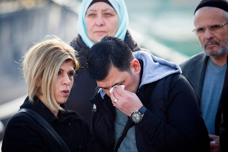 Abdullah Kurdi and his siter Tima react in front of a Sea-Eye rescue ship named after his son and her nephew Alan Kurdi during its inauguration in Palma de Mallorca on February 10,  2019.  The former research vessel "Professor Albrecht Penck" was rebaptised "Alan Kurdi", after the Syrian boy who was drowned during a ship wreck in the Mediterranean Sea. / AFP / JAIME REINA
