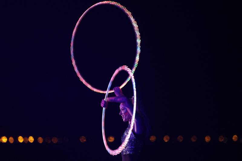 A woman plays with a hula hoop during a party in the Saudi Red Sea resort.